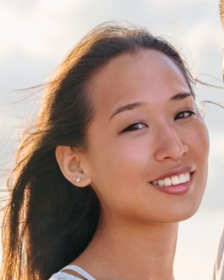 Clear female portrait with visible facial features and natural lighting for caricature