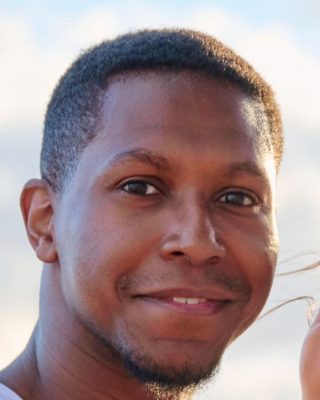 Clear male portrait with front-facing pose and visible facial features for caricature